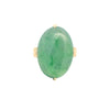 Top view of an oval jade cabochon ring set in polished 18k yellow gold with a smooth, luminous green jade center.