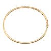 Top view showing the oval shape and evenly spaced diamond accents of the Tiffany & Co. Etoile bangle in 18k gold.