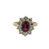 Vintage yellow gold ring featuring an oval ruby center with a sparkling diamond halo