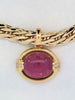 Gump's 18K gold pendant with a pink horizontal tourmaline cabochon, diamond accents, and a hinged bail design. On chain.