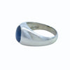 Side profile of platinum gypsy set ring with blue star sapphire