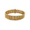 Reverse view of a Roberto Coin 18K gold bamboo bracelet with a signature hidden ruby beneath the clasp
