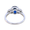 Side view of sapphire and diamond ring showing prong setting and gallery