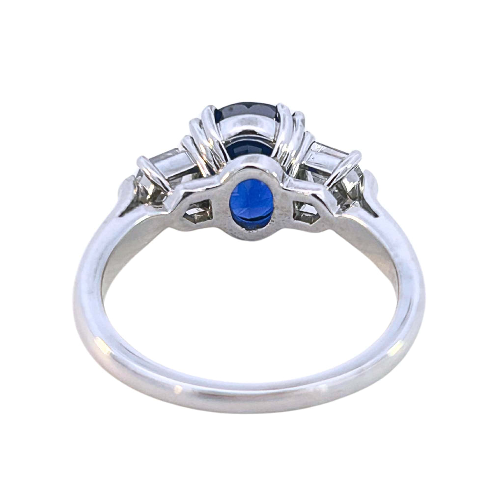 Side view of sapphire and diamond ring showing prong setting and gallery