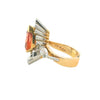 Side view of topaz and diamond ring showing raised setting and mixed metal construction