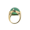 Side view highlighting the four-prong compass setting and sleek 18k yellow gold shank of this classic jade ring.