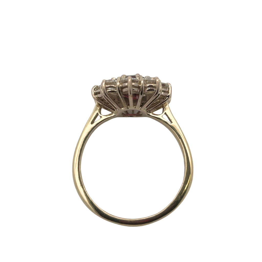 Side profile showing handcrafted wirework undergallery and prong-set ruby and diamonds