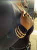 Stretchable gold rope bracelet with white gold rondel set with diamonds, on model with two other matching FOPE bracelets.
