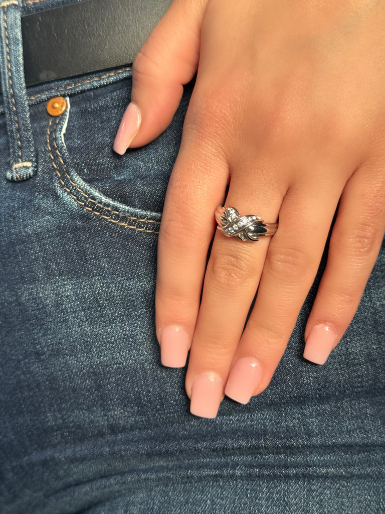 Tiffany & Co. SIGNATURE 18K White Gold Ring with "X" Motif and 15 Diamonds (0.20 CTW) - Timeless design symbolizing love and commitment, size 7.5, ideal for daily wear, on model with jeans.