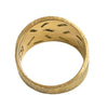 Interior view of textured gold band ring with diamond settings