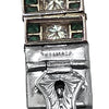 Close-up of the bracelet’s Tiffany-marked safety clasp, showing the reverse of the diamond and emerald links.