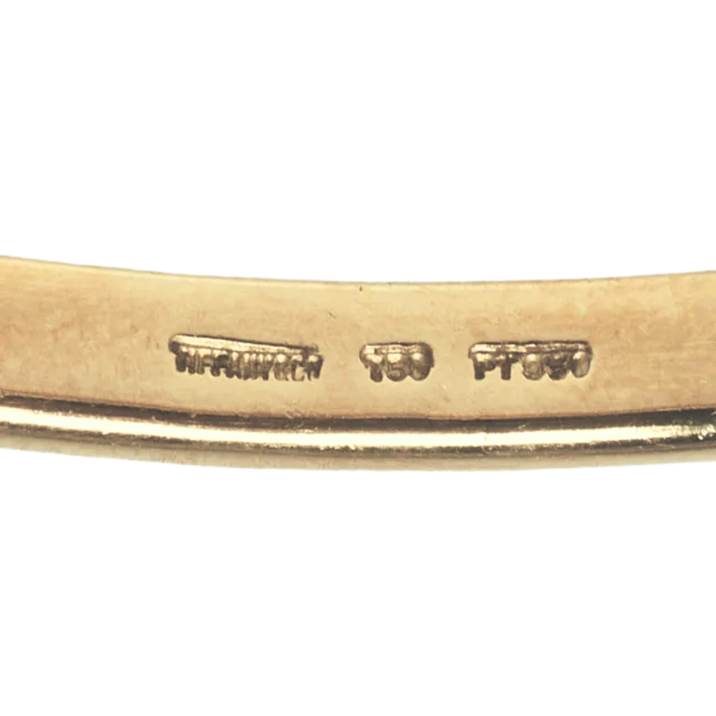 Tiffany & Co. Etoile bangle interior showing Tiffany & Co., 750, and PT950 hallmarks
