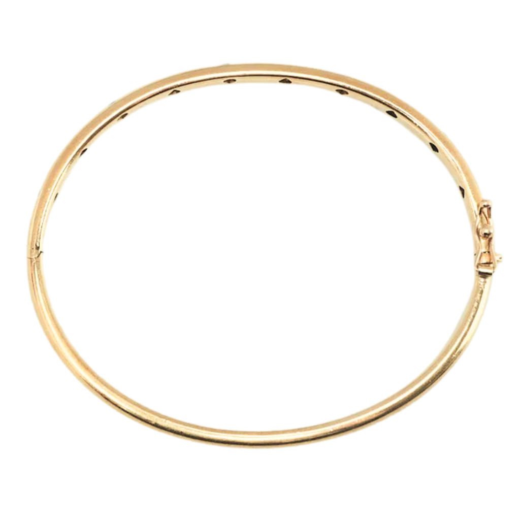 Tiffany & Co. Etoile yellow gold bangle with flush-set diamond gemstones in platinum bezels, side view