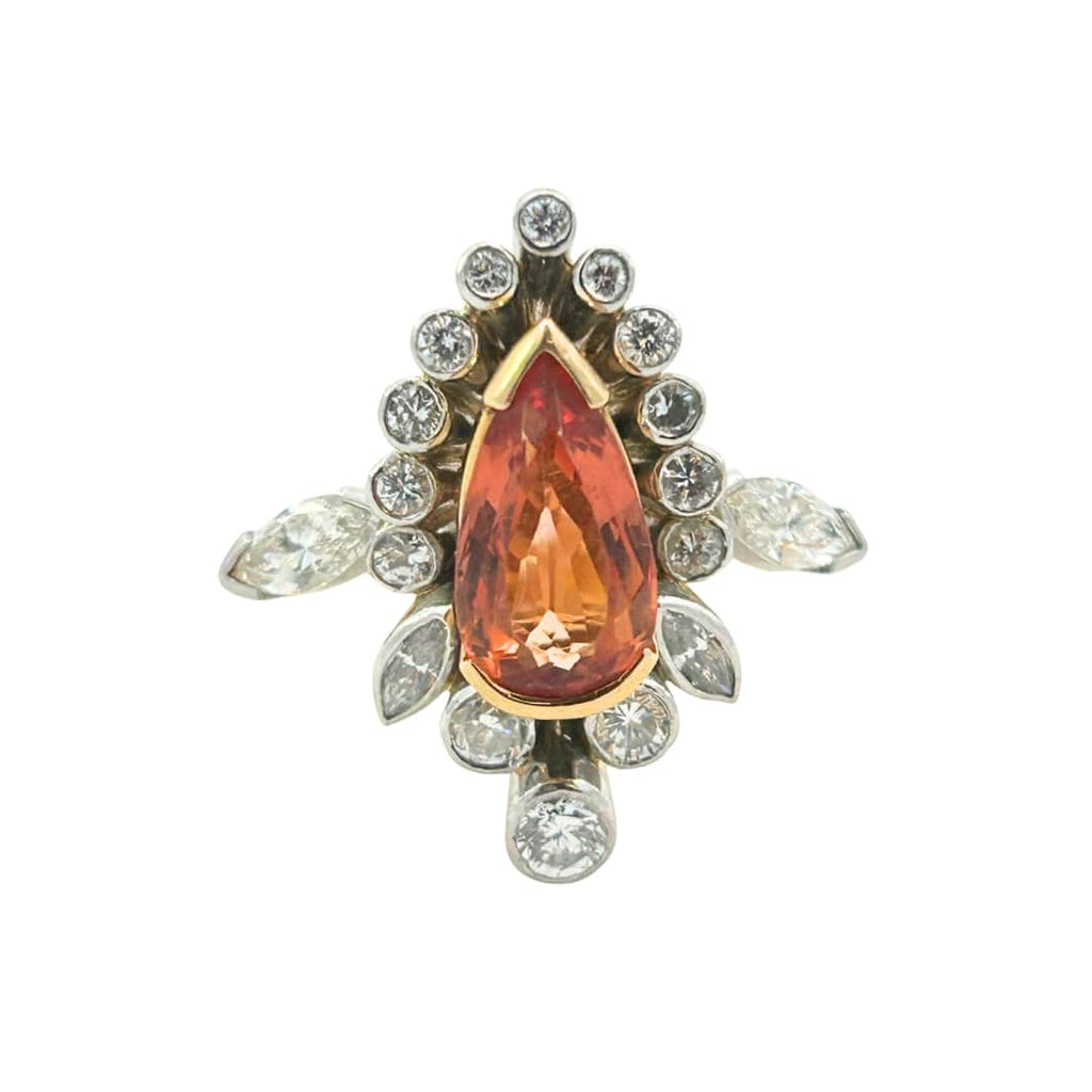 Pear shaped orange topaz ring with diamond halo in yellow gold and platinum