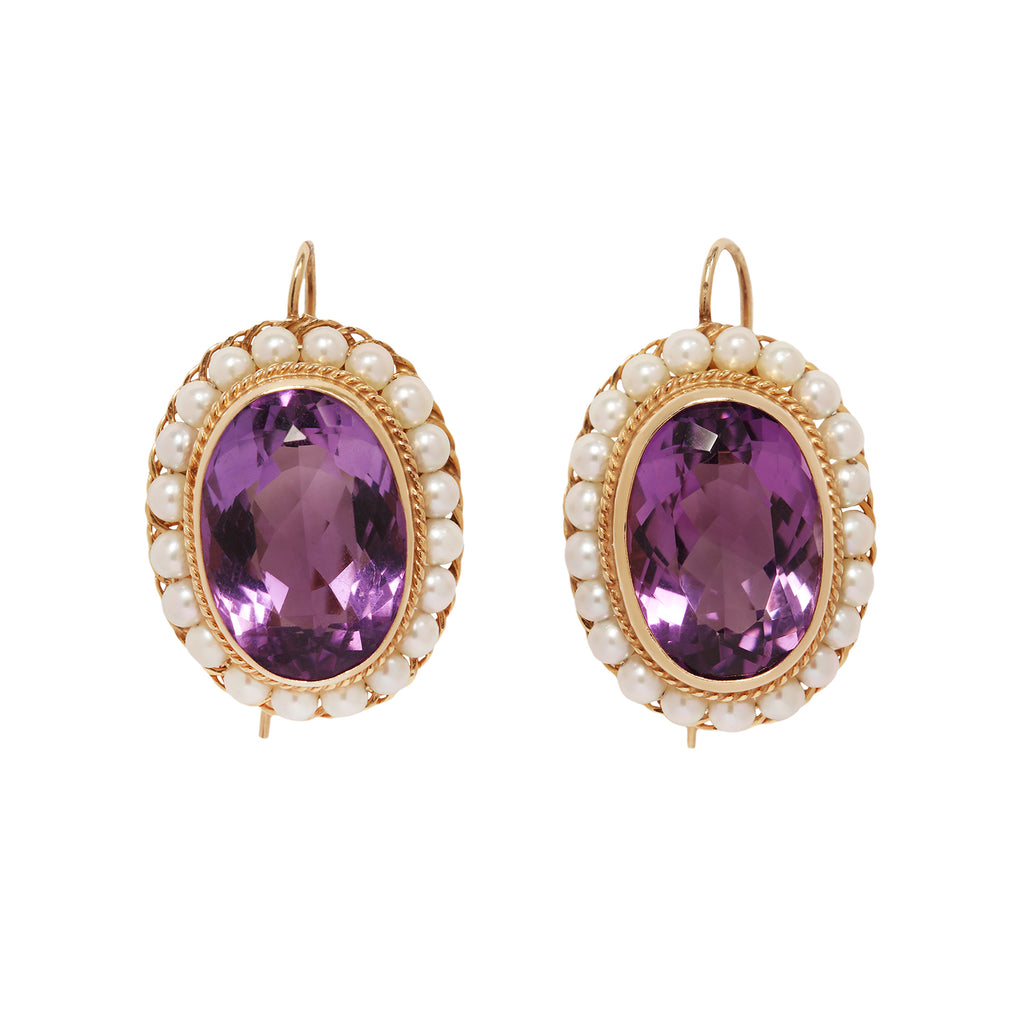 Elegant Victorian 14K gold wire hook earrings with oval amethysts, twisted gold detail, and a pearl frame.