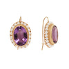 Elegant Victorian 14K gold wire hook earrings with oval amethysts, twisted gold detail, and a pearl frame. Side view.