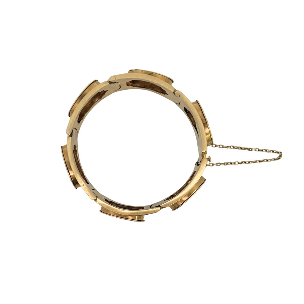 Back view of Victorian 18K gold bracelet showing curved panel construction and safety chain.