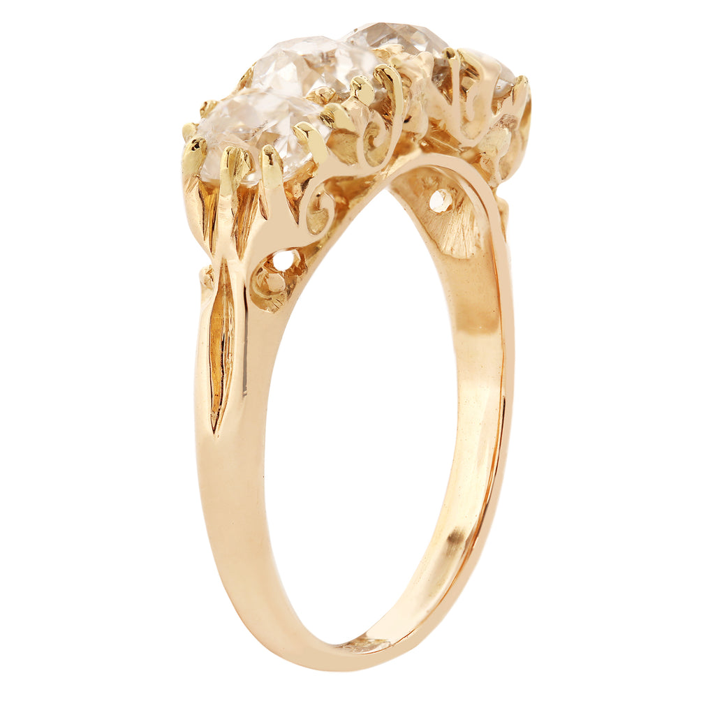 Perspective view of Victorian 4 diamond 18k yellow gold open scrollwork ring.