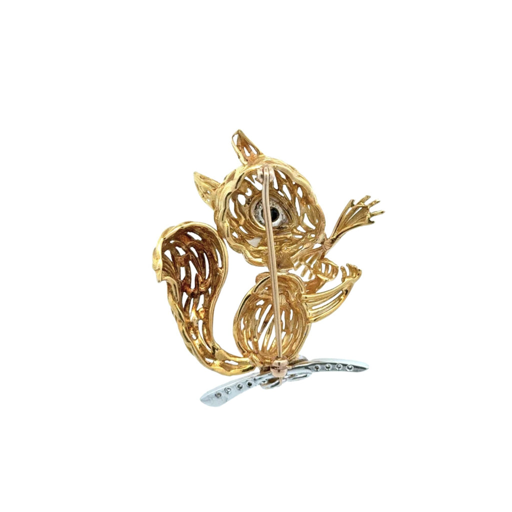 Back view of vintage 16K yellow gold squirrel brooch showing openwork construction and pin mechanism