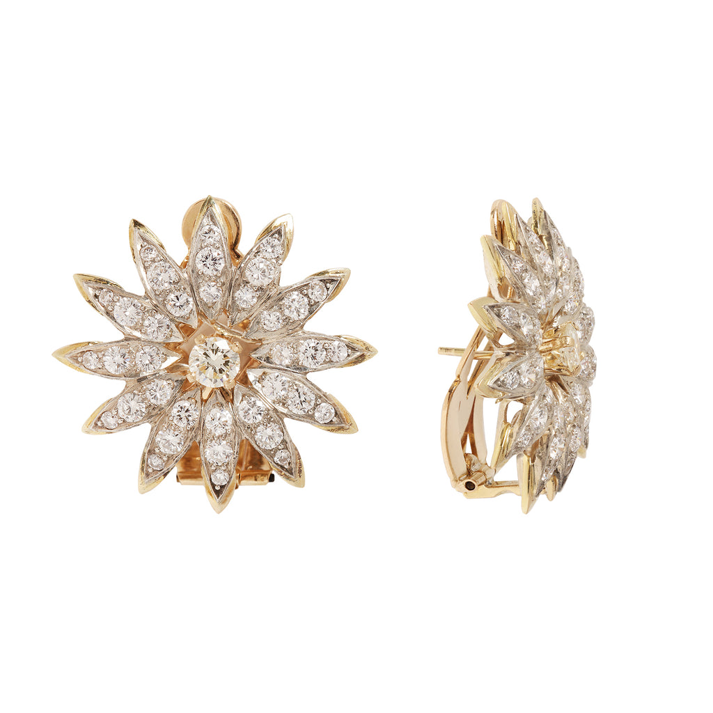 Side view of bold flower earrings with 74 diamonds set into the 14k yellow gold petals.