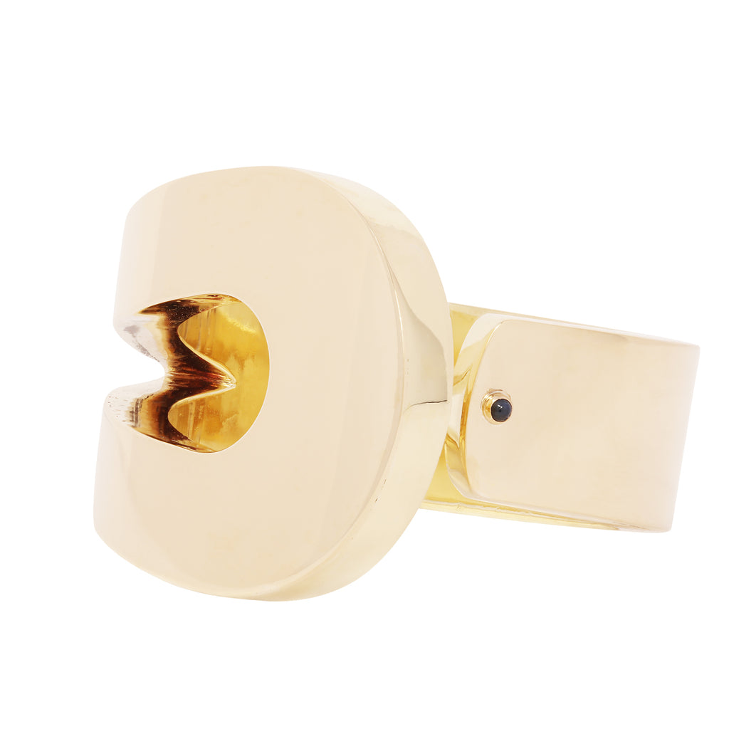 Estate Cartier 18k yellow gold hinged bangle with sculptural loop design, 40mm width. Angle view