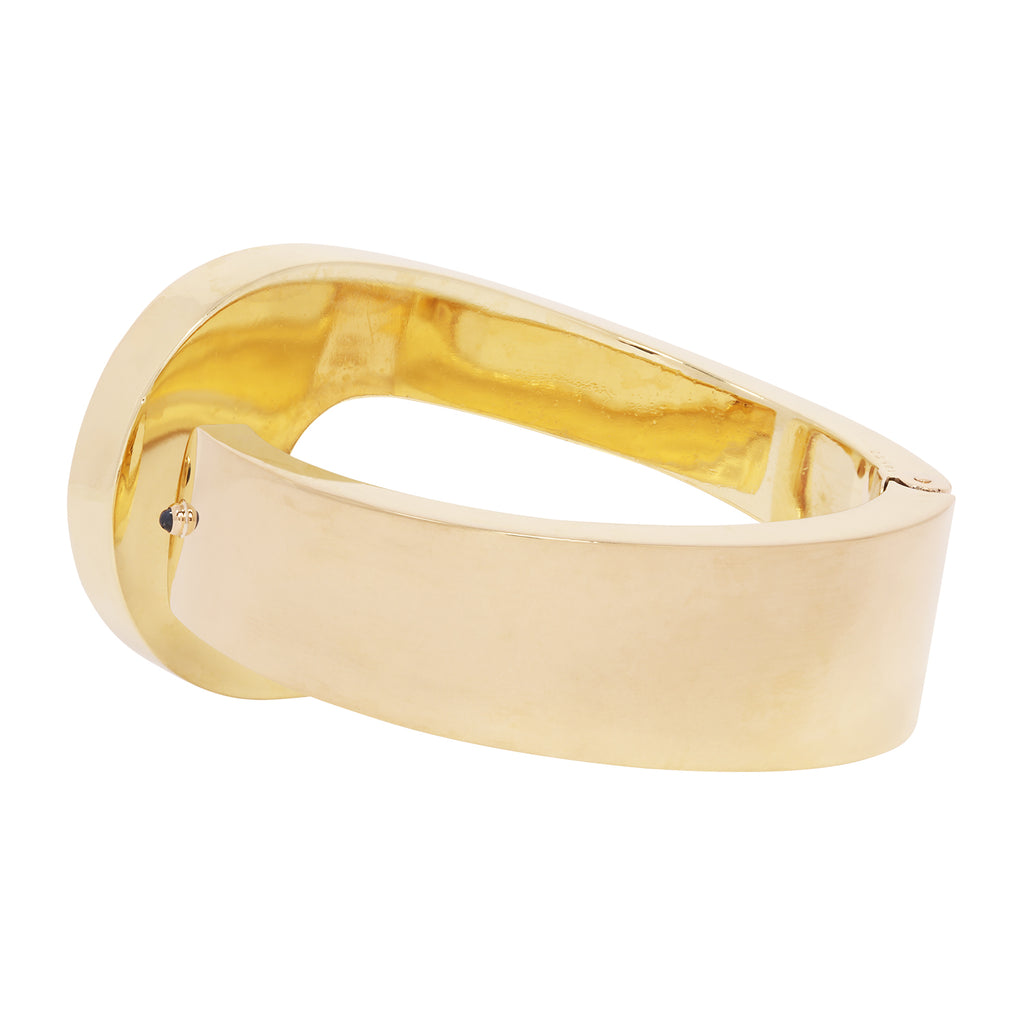 Estate Cartier 18k yellow gold hinged bangle with sculptural loop design, 40mm width. Back view.