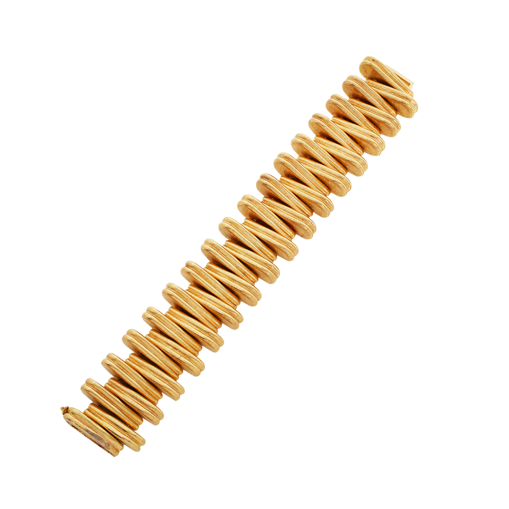 Vintage Cartier 18k yellow gold bracelet with alternating triangular links, Florentine engraved finish, and concealed foldover clasp; 7 inches.