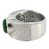 Contemporary wide band ring set with a 4.04ct Colombian trapiche emerald and 1.74ct pavé diamonds.