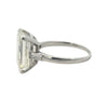 Platinum emerald cut diamond engagement ring featuring a 6.02ct M/VS1 GIA-certified center stone with tapered baguette side diamonds.