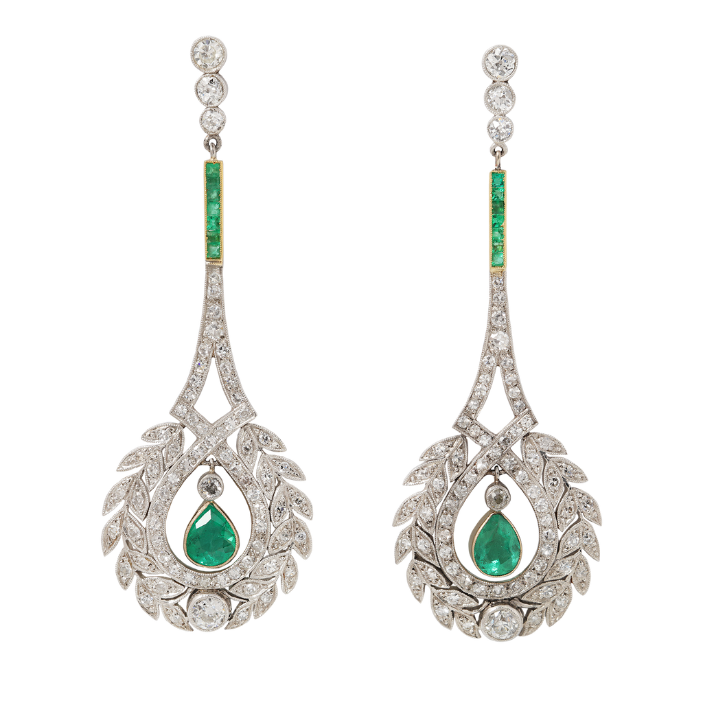 Estate emerald and diamond drop earrings in platinum with Edwardian-style wreath motif.