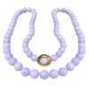 Gump’s 32-inch graduated Type A lavender jade bead necklace with 18k yellow gold clasp set with cabochon jade.