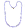 Gump’s 32-inch graduated Type A lavender jade bead necklace with 18k yellow gold clasp set with cabochon jade.