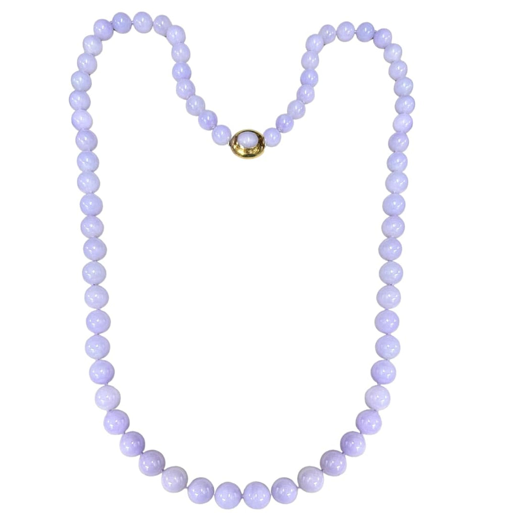 Gump’s 32-inch graduated Type A lavender jade bead necklace with 18k yellow gold clasp set with cabochon jade.