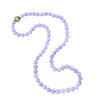 Gump’s 32-inch graduated Type A lavender jade bead necklace with 18k yellow gold clasp set with cabochon jade.