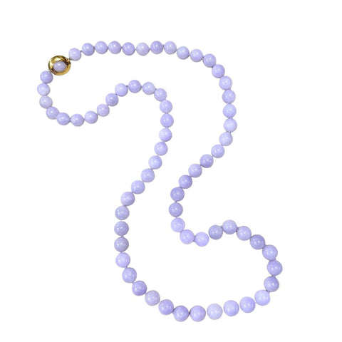 Gump’s 32-inch graduated Type A lavender jade bead necklace with 18k yellow gold clasp set with cabochon jade.