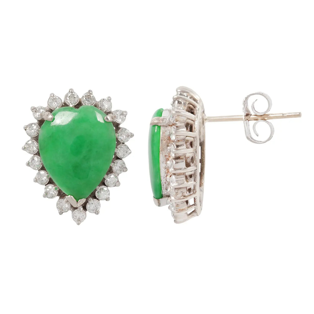 Side views of pear-shaped jadeite earrings with diamond halo settings in white gold.