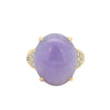 Front view of a vintage Gump’s 18k yellow gold ring with a GIA-certified lavender jade cabochon and pavé diamond accents.