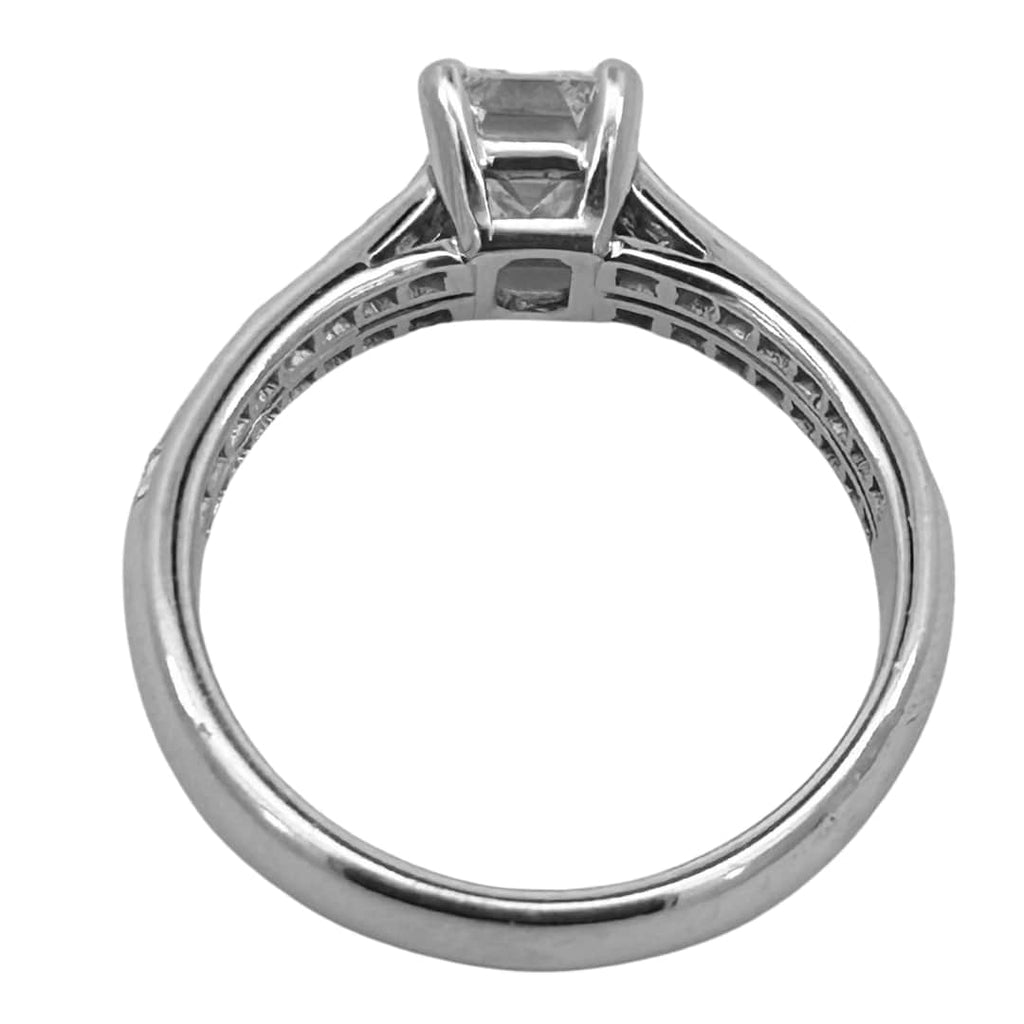 Tiffany & Co. emerald cut diamond engagement ring in platinum with a 1.14ct G/ VVS2 center diamond and channel-set square cut diamond shoulders.