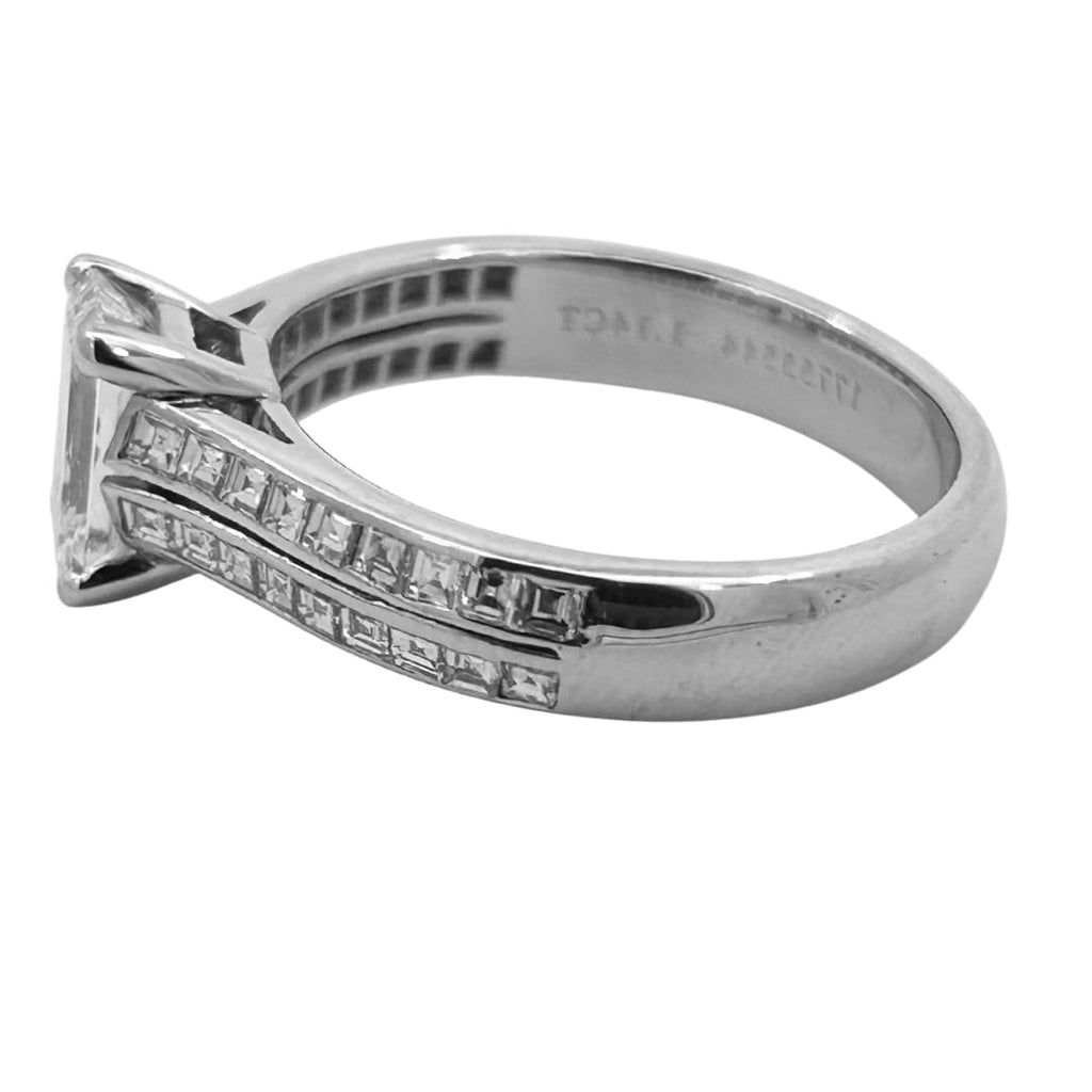 Tiffany & Co. emerald cut diamond engagement ring in platinum with a 1.14ct G/ VVS2 center diamond and channel-set square cut diamond shoulders.