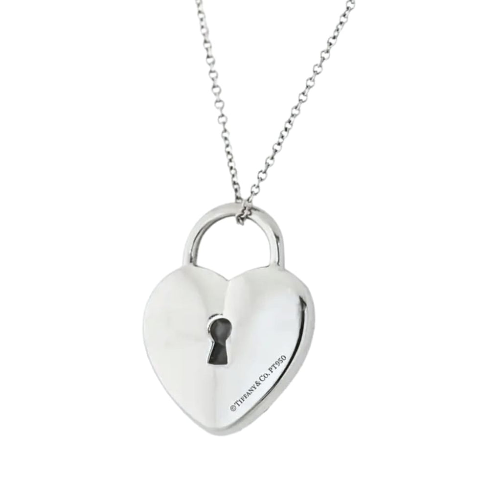 Tiffany & Co. platinum heart-shaped padlock pendant pavé-set with round brilliant-cut diamonds, suspended from a platinum chain. Reverse side shown with polished finish.