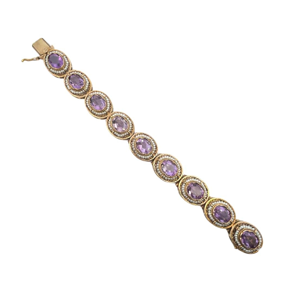 Gold amethyst bracelet with delicate pearl borders encircling each gemstone.