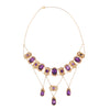 Front view of a Victorian cannetille necklace showcasing bezel-set amethysts and seed pearls in a draped 16” swag design.