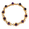 Arts and Crafts bracelet with bullet-shaped Amethyst cabochons set into  individual hand-made gold swirls, full view