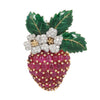 Oscar Heyman strawberry brooch with oval cabochon rubies on the gold body, diamonds on the platinum flowers, and green enamel on the leaves.